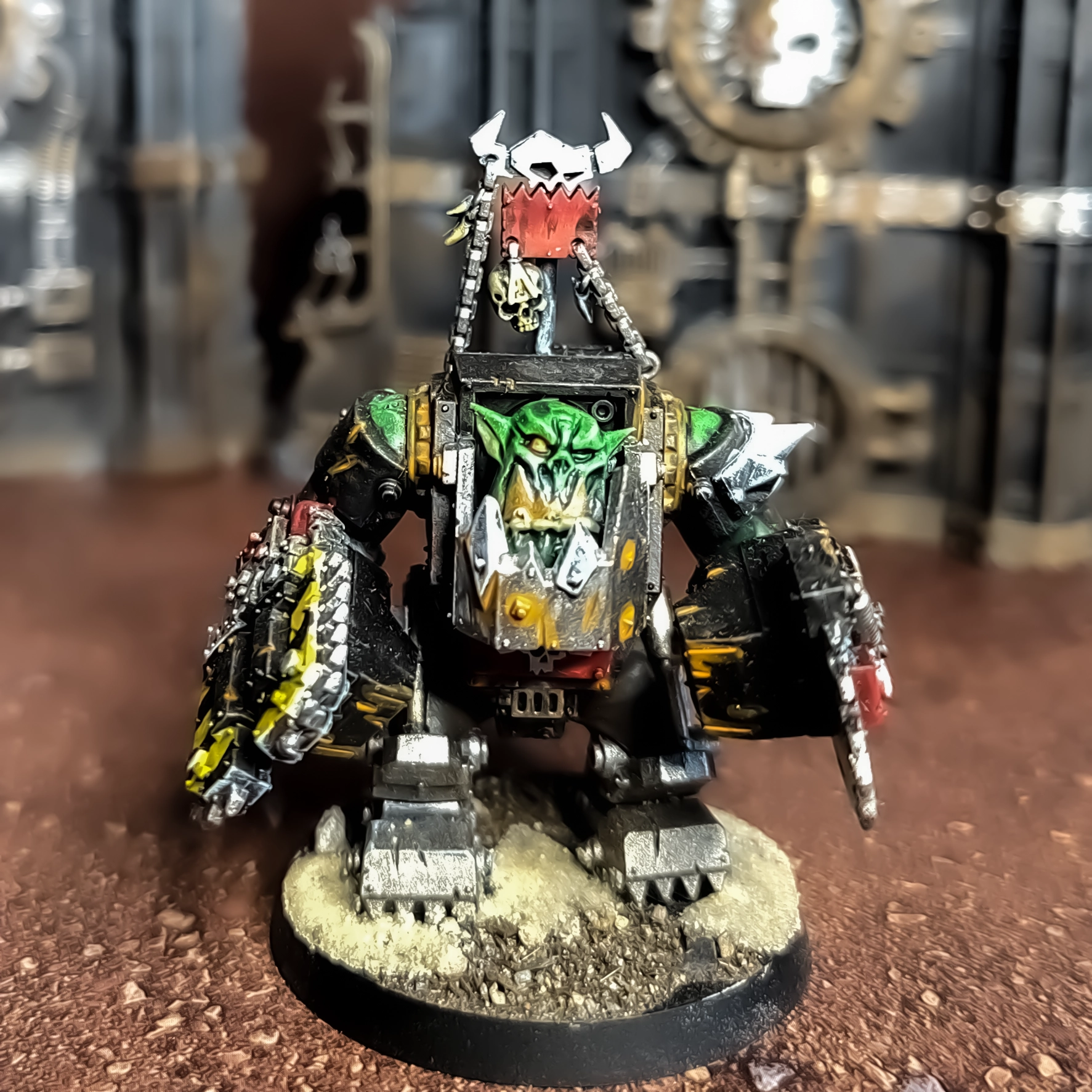 A photograph of an Ork Meganob model, painted to a basic tabletop standard.