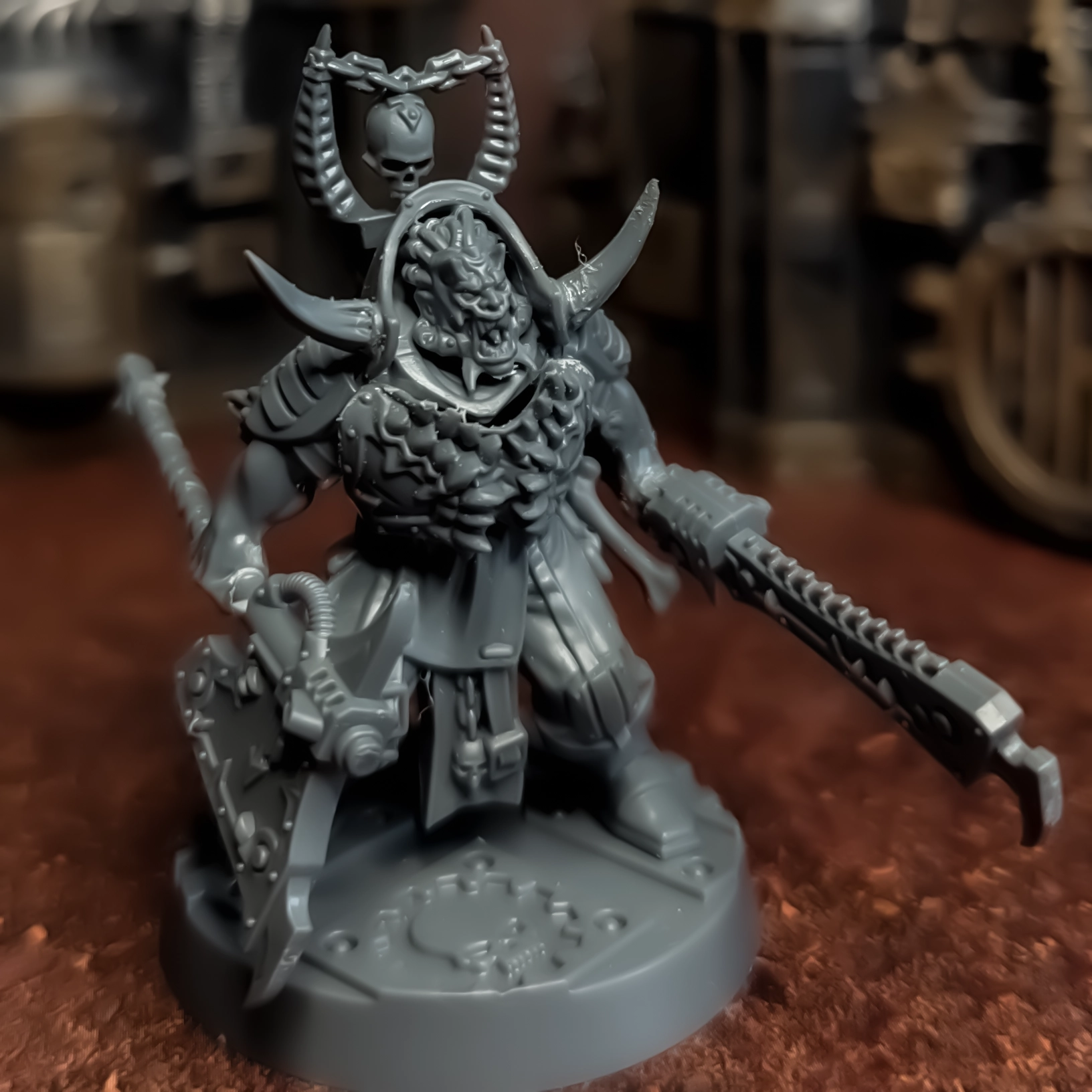 An unpainted conversion piece using bits from the Corpse Grinder Cults kit and the Eightbound Kit