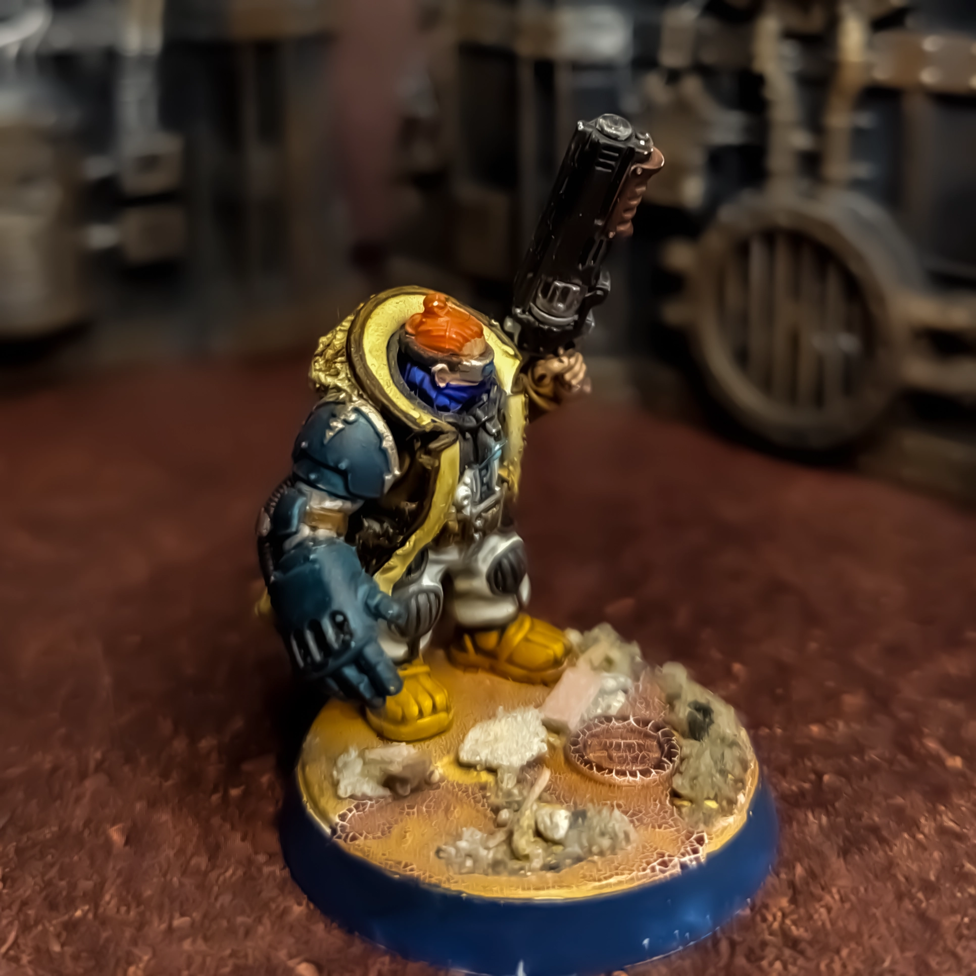 A squat with a power fist and a shotgun and a short coat. Using bits from the Hernkyn Pioneers and Tempestus Scions as well as Green Stuff sculpting.