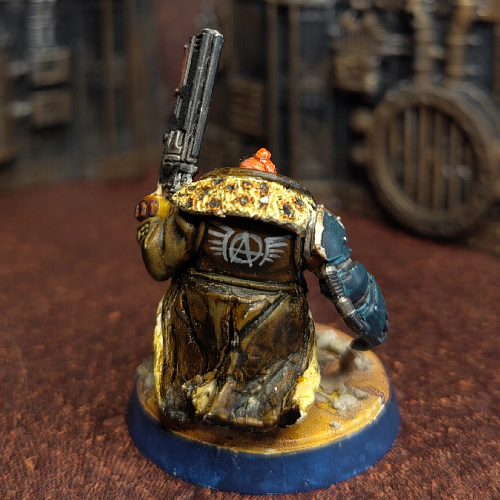A squat with a power fist and a shotgun and a short coat. Using bits from the Hernkyn Pioneers and Tempestus Scions as well as Green Stuff sculpting.