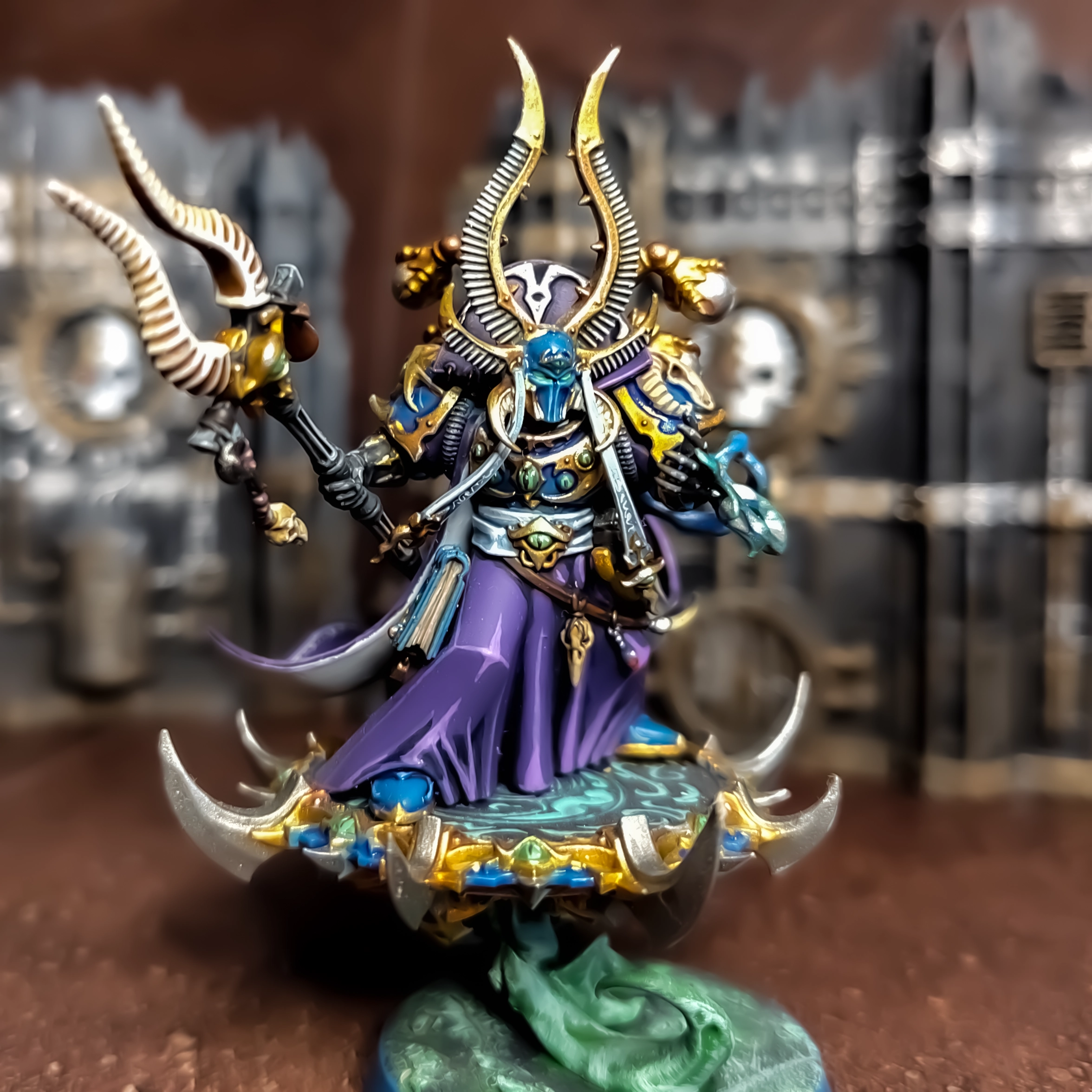 A photograph of Ahzek Ahriman of the Thousand Sons, showing highlighting, freehands and gradients painted to a parade ready standard.